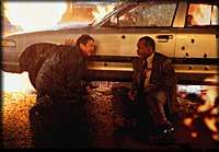 Lethal Weapon 4 - Safety behind police car from a shower of bullets and flamer thrower